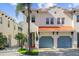 Two-story home with a double garage and terracotta roof at 102 S Moody Ave # 3, Tampa, FL 33609