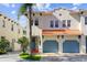 Two-story home with a double garage and terracotta roof at 102 S Moody Ave # 3, Tampa, FL 33609