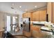 Modern kitchen with light wood cabinets, stainless steel appliances, and granite countertops at 102 S Moody Ave # 3, Tampa, FL 33609