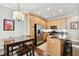Modern kitchen with light wood cabinets, stainless steel appliances, and an island at 102 S Moody Ave # 3, Tampa, FL 33609