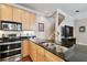 Kitchen features double sink, stainless steel appliances, and granite countertops at 102 S Moody Ave # 3, Tampa, FL 33609