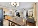 Eat-in kitchen with light wood cabinets, an island, and stainless steel appliances at 102 S Moody Ave # 3, Tampa, FL 33609