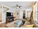 Spacious living area with hardwood floors, sectional sofa and fireplace at 102 S Moody Ave # 3, Tampa, FL 33609