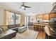 Open living room and kitchen with hardwood floors, and neutral colors at 102 S Moody Ave # 3, Tampa, FL 33609
