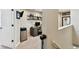 Home office with desk, computer, and built-in shelving at 102 S Moody Ave # 3, Tampa, FL 33609