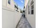 Long and narrow side yard with a paved pathway and a grill at 102 S Moody Ave # 3, Tampa, FL 33609