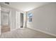 Neutral bedroom with plush carpeting, window, and closet at 12241 Meditation Trl, Venice, FL 34293