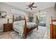 Main bedroom with king-size bed, wood furniture, and pool view at 1304 Steeple Hill Ct, Brandon, FL 33511