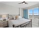 Guest bedroom with a metal frame bed and water views at 1325 Snell Isle Ne Blvd # 709, St Petersburg, FL 33704