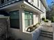 Side view of house with window, planter, and brick patio at 1688 Watermark Ne Cir # 1688, St Petersburg, FL 33702