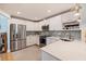 Modern kitchen with white cabinets, stainless steel appliances, and quartz countertops at 1688 Watermark Ne Cir # 1688, St Petersburg, FL 33702