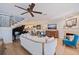 Spacious living room with an open floorplan, hardwood floors, and elegant decor with lots of natural light at 1688 Watermark Ne Cir # 1688, St Petersburg, FL 33702