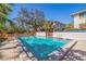 Tranquil community pool surrounded by lush landscaping, offering a serene and relaxing atmosphere at 1688 Watermark Ne Cir # 1688, St Petersburg, FL 33702