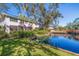 Condo building with private screened patio overlooking a pond at 1688 Watermark Ne Cir # 1688, St Petersburg, FL 33702