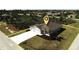 Aerial view of a single-Gathering home with a driveway at 174 Green Oak Park, Rotonda West, FL 33947