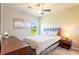 Bright bedroom with a comfortable bed and wood nightstand at 174 Green Oak Park, Rotonda West, FL 33947