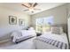 Well-lit bedroom with two twin beds, ideal for guests at 174 Green Oak Park, Rotonda West, FL 33947