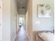 Bright hallway with tile flooring and access to bedrooms at 174 Green Oak Park, Rotonda West, FL 33947
