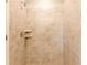 Large walk-in shower with neutral tile and built-in shelving at 174 Green Oak Park, Rotonda West, FL 33947