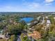 Community overview, showcasing lake, buildings and surrounding landscape at 204 Cypress Ln, Oldsmar, FL 34677