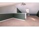 Spacious loft area with a skylight and neutral carpeting at 213 S Habana Ave, Tampa, FL 33609