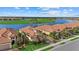 Aerial view of homes near a lake and golf course at 23503 Waverly Cir, Venice, FL 34293