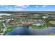 Community clubhouse with pool, tennis courts, and parking at 23503 Waverly Cir, Venice, FL 34293