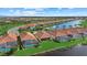 Aerial view of community with lake and homes at 23503 Waverly Cir, Venice, FL 34293