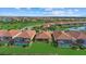 Aerial view of community with lake and homes at 23503 Waverly Cir, Venice, FL 34293