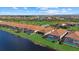 Aerial view of community with lake and homes at 23503 Waverly Cir, Venice, FL 34293