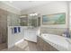 Spa-like bathroom with walk-in shower and soaking tub at 23503 Waverly Cir, Venice, FL 34293
