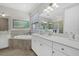 Elegant bathroom with soaking tub and double vanity at 23503 Waverly Cir, Venice, FL 34293