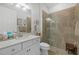 Clean bathroom with a shower and white vanity at 23503 Waverly Cir, Venice, FL 34293