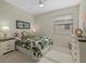 Bright bedroom with a queen-size bed and neutral decor at 23503 Waverly Cir, Venice, FL 34293