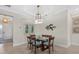 Spacious dining room with a glass table and seating for six at 23503 Waverly Cir, Venice, FL 34293