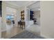 Open and airy foyer showcasing a home office and living area at 23503 Waverly Cir, Venice, FL 34293
