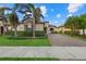 Single-Gathering home with stone accents and lush landscaping at 23503 Waverly Cir, Venice, FL 34293