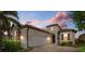 Beautiful one-story home with brick paver driveway and landscaping at 23503 Waverly Cir, Venice, FL 34293