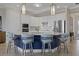 Elegant kitchen with a center island and blue barstools at 23503 Waverly Cir, Venice, FL 34293