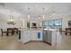 Modern kitchen featuring a large island and stainless steel appliances at 23503 Waverly Cir, Venice, FL 34293