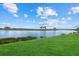 Expansive lake view with lush green grass at 23503 Waverly Cir, Venice, FL 34293