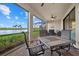 Outdoor patio with seating and lake view at 23503 Waverly Cir, Venice, FL 34293