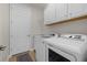 Laundry room with washer, dryer, and cabinets at 23503 Waverly Cir, Venice, FL 34293