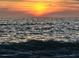 Stunning sunset over calm ocean waters at 23503 Waverly Cir, Venice, FL 34293