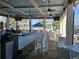 Outdoor bar with seating, overlooking the pool area at 23503 Waverly Cir, Venice, FL 34293