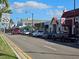 Street scene with shops and parked cars at 23503 Waverly Cir, Venice, FL 34293