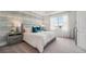 Bright bedroom with large window and neutral color scheme at 31526 Ancient Sage Rd, Wesley Chapel, FL 33545