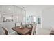 Bright dining room with table, chairs and view into living room at 31526 Ancient Sage Rd, Wesley Chapel, FL 33545