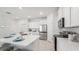 Modern kitchen with white cabinets, stainless steel appliances and large island at 31526 Ancient Sage Rd, Wesley Chapel, FL 33545