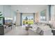 Living room with sliding glass doors leading to backyard at 31526 Ancient Sage Rd, Wesley Chapel, FL 33545